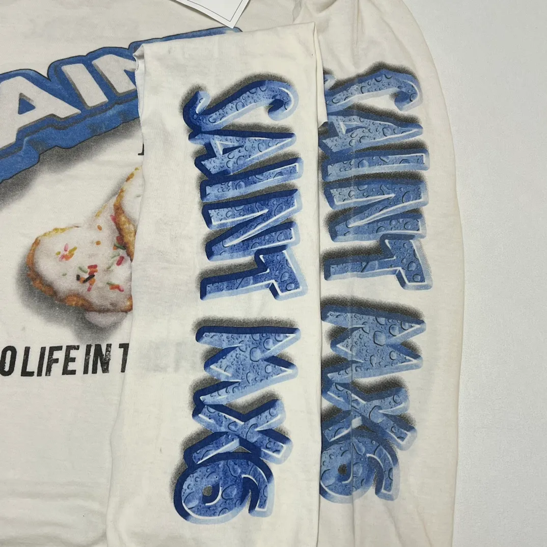 Printing proofing SAINT Mxxxxxx HEART COOKIES L/S TEE/WHT Love Oreo printed long sleeves Off-white S-XL Customized co-branded main mark/wash mark Correct version Ready-made garments washed and distressed Full of VINTAGE feeling Top-notch printing technology Perfect restoration